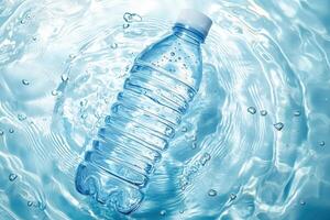 Plastic water bottle floating in clear blue water with bubbles and ripples photo