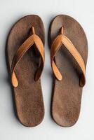 Stylish brown leather flip flops with minimal design on a light background photo