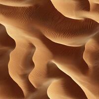Abstract aerial view of curved sand dunes in a desert landscape photo