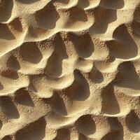 Abstract texture of sand with patterns and shadows in natural light photo