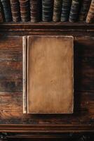 Antique book on wooden table against vintage bookshelf background photo