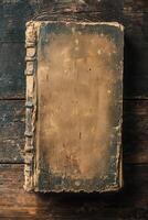 Vintage worn leather-bound book on rustic wooden table photo