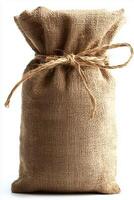 Natural burlap sack tied with twine for rustic storage or packaging photo