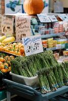 Fresh Produce Display at Market with Asparagus and Citrus Fruits photo
