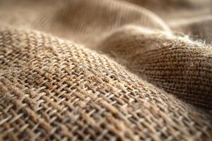 Close-up of textured burlap fabric, showcasing its natural fibers and woven patterns. photo