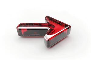A vibrant red glass arrow pointing to the right, symbolizing direction and movement. photo
