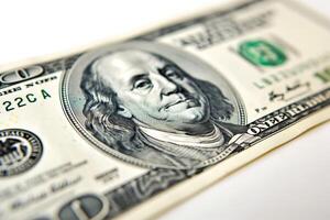 Close-up of a hundred-dollar bill highlighting intricate details and textures. photo