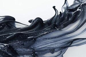 An abstract close-up of glossy black fluid swirling elegantly with glittering particles. photo