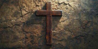 A rustic wooden cross against a textured stone background, symbolizing faith and spirituality. photo