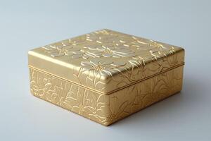 An elegant golden floral embossed gift box, perfect for special occasions and celebrations. photo
