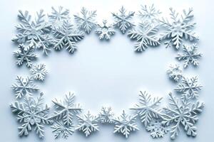 An intricate arrangement of snowflakes creates a beautiful winter frame on a soft blue background. photo