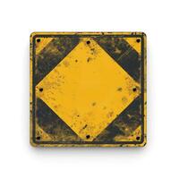 A weathered yellow caution sign with a distinctive diamond shape, showcasing wear and tear over time. photo