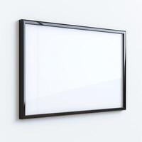 Modern black-framed empty picture frame on a light wall. photo