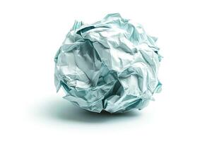 A crumpled sheet of light blue paper resting on a flat surface, conveying a sense of discarded ideas or creativity. photo