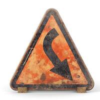 A weathered, triangular road sign indicating a sharp turn, featuring an orange and black color scheme. photo