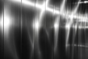A sleek, reflective metallic surface with intricate light patterns, creating a modern and industrial aesthetic. photo