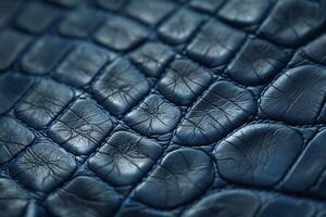 Close-up of luxurious dark blue crocodile leather, highlighting intricate textures and patterns. photo