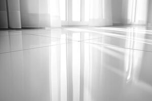 A modern, spacious interior featuring glossy white tiles reflecting natural light from large windows. photo