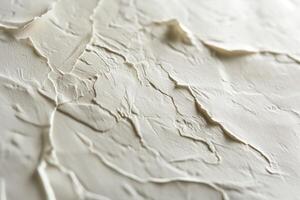 Textured white surface with intricate patterns, resembling natural formations. photo