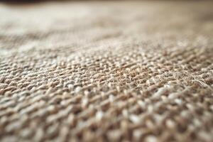 Close-up of textured jute fabric, showcasing the intricate weave and natural tones. photo