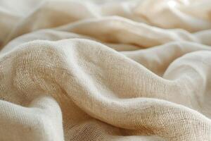 Soft, textured beige fabric draping gracefully, adding warmth and depth to any setting. photo