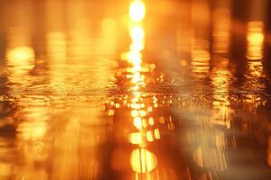 Golden sunset reflections shimmering on the water's surface, creating a tranquil and mesmerizing scene. photo