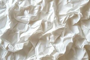 Textured close-up of crumpled white paper, showcasing intricate folds and shadows. photo
