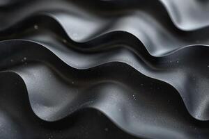 Close-up of textured black surface with soft wave patterns and fine droplets, creating a modern and sleek appearance. photo