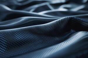 Close-up of textured black fabric showcasing wavy patterns and sheen. photo