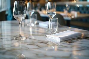 Elegant table setting with crystal glassware and polished marble surface, creating a sophisticated dining atmosphere. photo