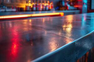 A close-up of a sleek bar top reflecting colorful lights in an atmospheric setting. photo