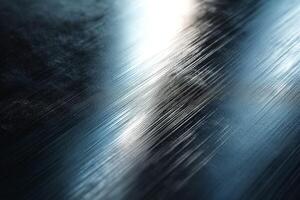 Close-up of a sleek, brushed metallic surface reflecting light, showcasing smooth texture and subtle patterns. photo
