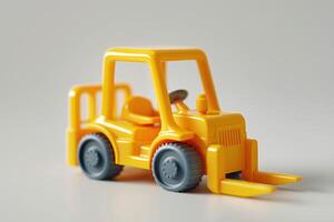 A vibrant yellow toy forklift sits against a neutral background, showcasing its playful design and sturdy wheels. photo