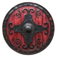 A striking round shield featuring intricate black metal designs on a vivid red wooden surface. photo