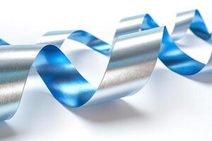 A shimmering silver and blue ribbon elegantly twists across a bright background, creating an eye-catching decorative element. photo