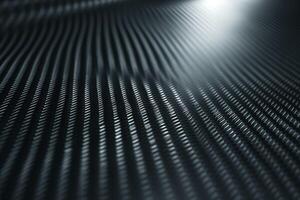 Abstract close-up of a textured surface featuring smooth, flowing grooves in shades of black and gray. photo