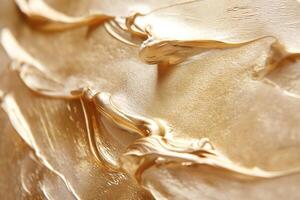 Close-up of shiny gold paint texture with smooth, flowing strokes, exuding a luxurious and artistic vibe. photo