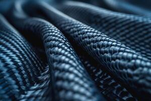 Close-up of textured blue woven fabric, showcasing intricate patterns and depth. photo