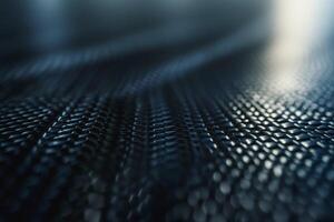 Close-up shot of textured black material creating an abstract pattern. photo