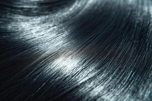 Close-up of shiny, smooth black hair showcasing its healthy texture and natural sheen. photo