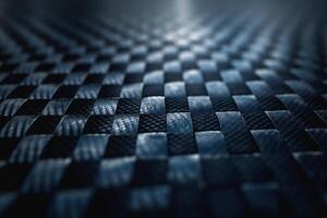Close-up of a textured black woven surface, showcasing intricate patterns and light reflections. photo