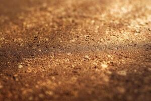 Beautifully textured close-up of a rich, earthy brown surface with a warm, glowing quality. photo