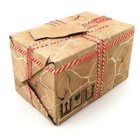 A worn and damaged cardboard box, tied with red and white string, evoking curiosity about its contents. photo