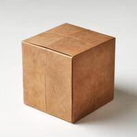 A simple, brown paper box isolated on a light background, evoking a sense of minimalism and eco-friendliness. photo