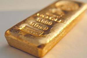 Close-up of a gleaming gold bullion bar, showcasing its rich texture and high purity, symbolizing wealth and investment. photo