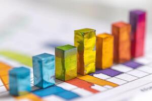 Colorful wooden blocks representing growth in data analysis on a financial chart. photo