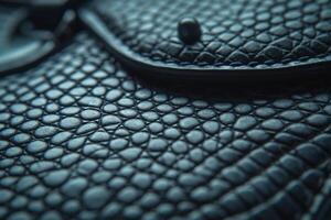 Close-up of a textured black leather surface showcasing intricate patterns and luxurious feel. photo