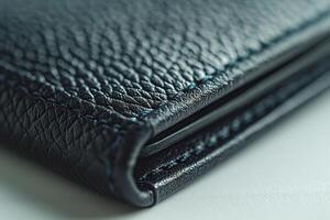 Close-up of a textured black leather wallet showcasing its fine stitching and craftsmanship. photo