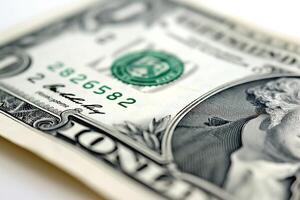 Close-up of a one-dollar bill, showcasing intricate details and textures of the currency. photo