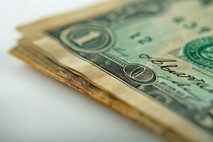 Close-up of folded U.S. dollar bills, showing intricate details and textures on the banknotes. photo